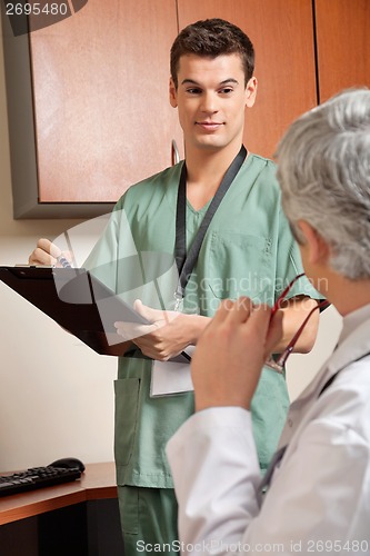 Image of Technician With Doctor At Clinic
