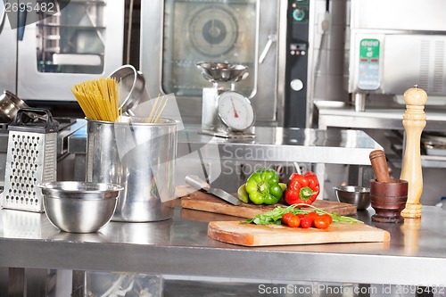 Image of Spaghetti Pasta And Bell Peppers On Kitchen Counter