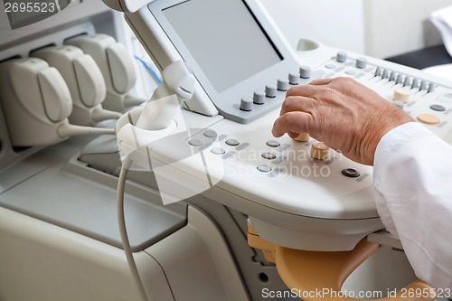 Image of Radiologist Operating Ultrasonic Machine