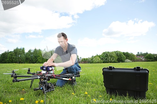 Image of Engineer Fixing UAV Drone in Park