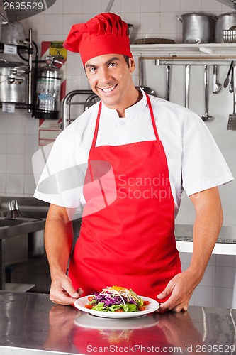 Image of Happy Male Chef With Dish