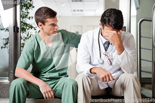 Image of Colleague Comforting Upset Doctor