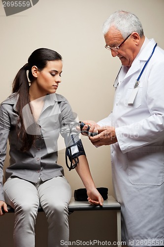 Image of Doctor Taking Woman's Blood Pressure