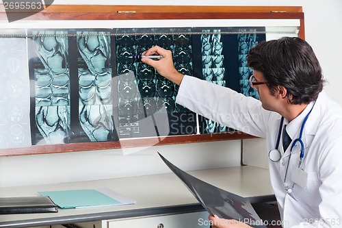 Image of Radiologist Reviewing X-ray At Clinic