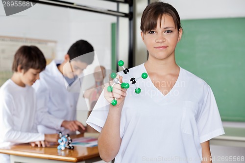 Image of Schoolgirl Holding Molecular Structure