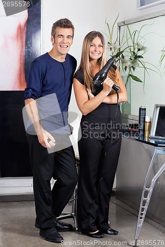 Image of Male And Female Hairdressers Standing Together