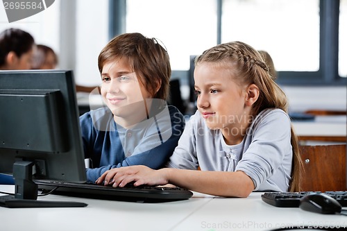 Image of Boy And Girl Using Desktop Pc In School Computer Lab