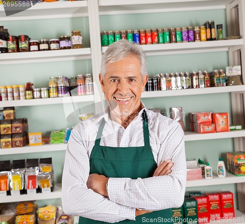 Image of Senior Male Owner Smiling At Supermarket
