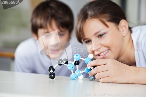 Image of Students Analyzing Molecular Structure At Desk
