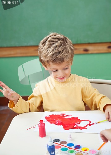 Image of Boy Painting With Watercolors In Art Class