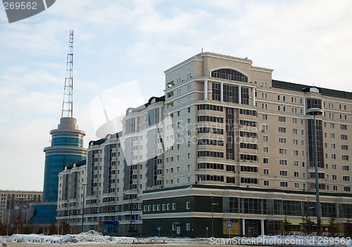 Image of Modern building and communicate mast.