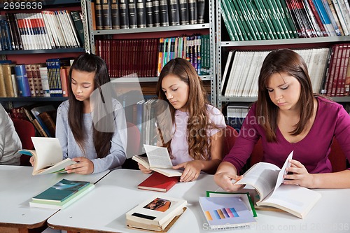 Image of Schoolgirls Reading Books In Library