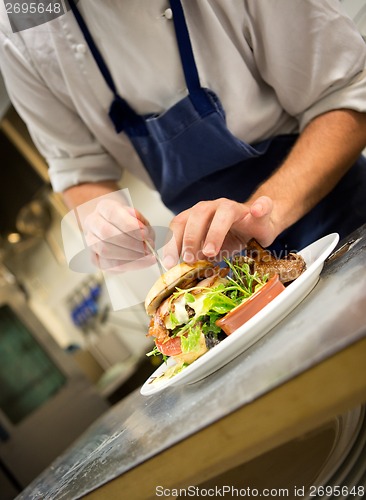 Image of Chef Preparing Gourmet Hamburger