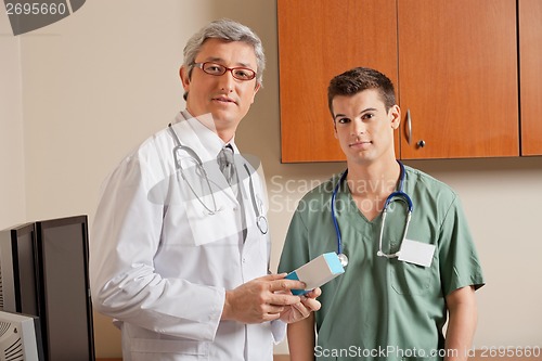 Image of Doctor Holding Medicine Box