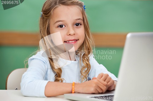 Image of Girl With Laptop At Classroom Desk