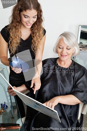 Image of Client And Hairdresser Choosing Hair Color