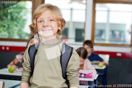 Image of Happy Schoolboy With Classmates Studying In Background