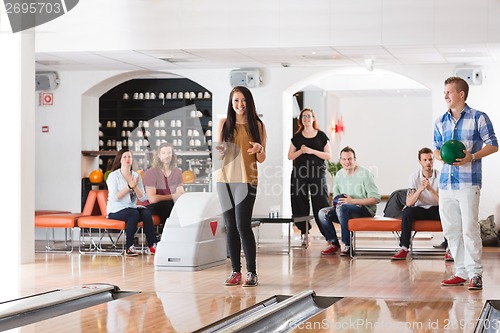 Image of Happy Woman With Friends in Bowling Club