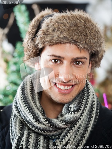 Image of Handsome Young Man At Christmas Store