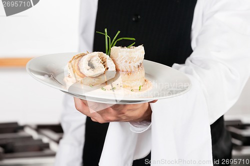 Image of Waiter Presenting Salmon Roll