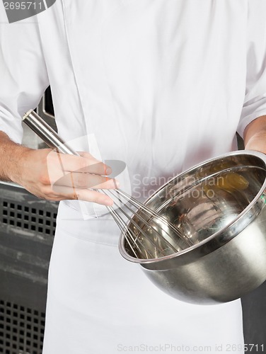 Image of Chef With Wire Wisk And Mixing Bowl