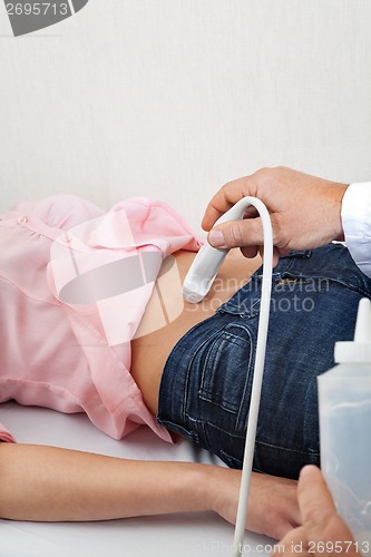 Image of Female Going Through Abdomen Ultrasound