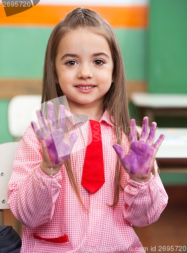 Image of Girl Showing Colored Hands In Classroom