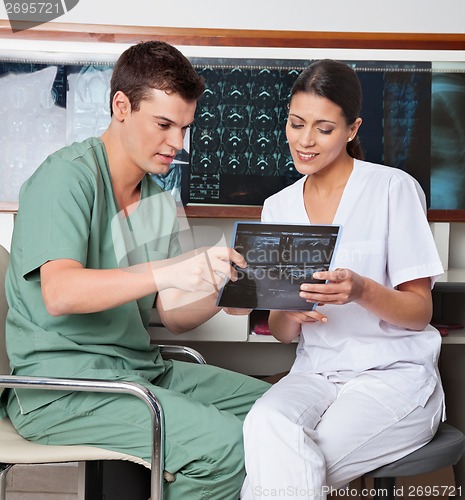 Image of Medical Technicians Discussing About X-ray