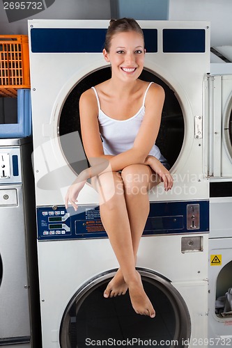 Image of Woman Sitting In Washing Machine