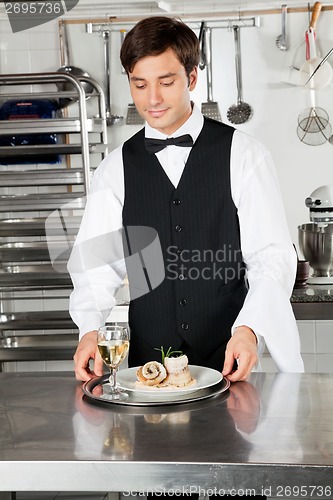 Image of Waiter With Salmon Roll And White Wine