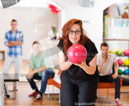 Image of Woman Ready With Bowling Ball in Club