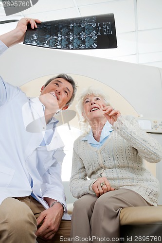 Image of Radiologist And Patient Looking At X-ray