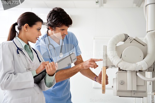 Image of Radiologist And Technician Working At Clinic