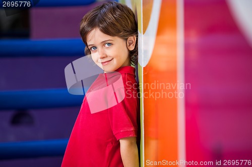 Image of Boy Standing Against Wall In Kindergarten