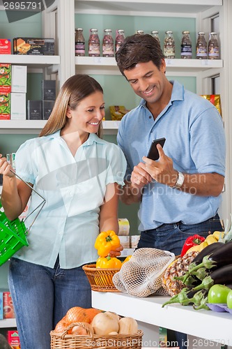 Image of Couple Using Mobilephone