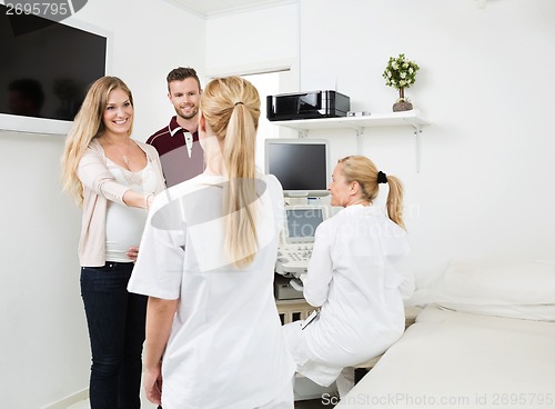 Image of Couple Visiting Gynecologist For Routine Checkup