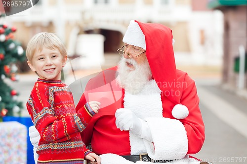 Image of Happy Boy Giving Letter To Santa Claus