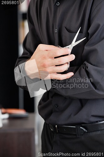 Image of Male Hairstylist With Scissors