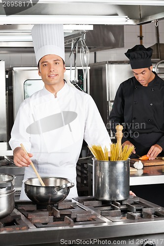 Image of Happy Chef Cooking Food