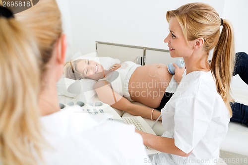 Image of Pregnant Woman Getting Ultrasound Examination