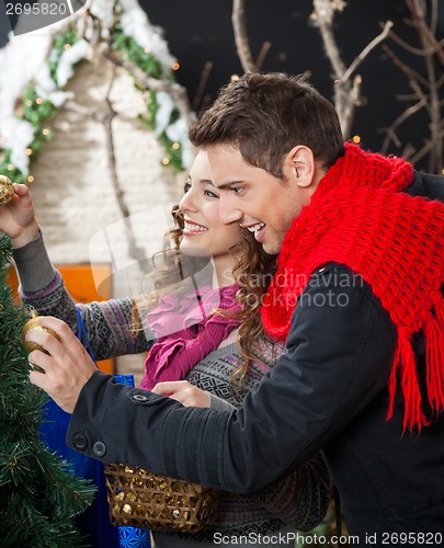 Image of Happy Couple Shopping For Christmas Tree