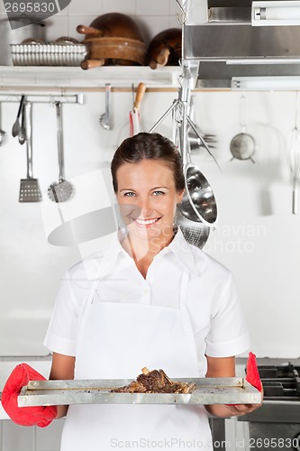 Image of Female Chef With Tray Of Meat