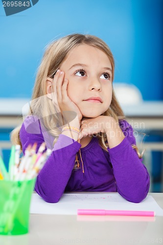 Image of Girl With Hand On Chin Looking Away In Class