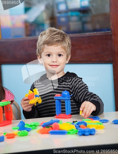 Image of Boy Playing With Blocks In Kindergarten