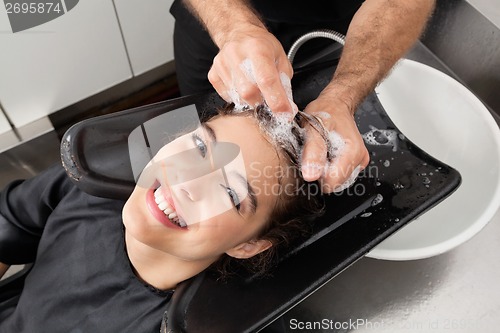 Image of Client Having Hair Washed By Hairdresser