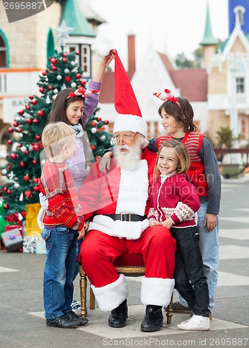 Image of Happy Children With Santa Claus