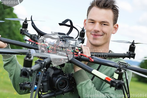 Image of Engineer Holding UAV With Camera