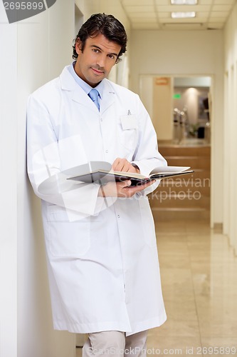 Image of Male Doctor Holding Book