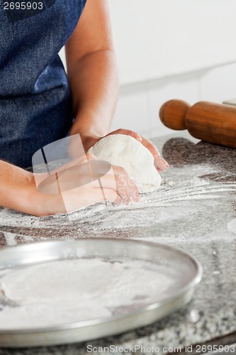 Image of Female Chef Kneading Dough