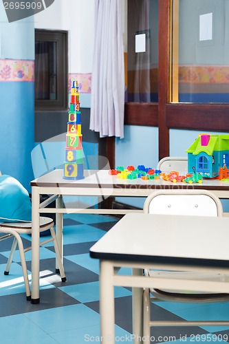 Image of Colorful Construction Blocks And House On Desk